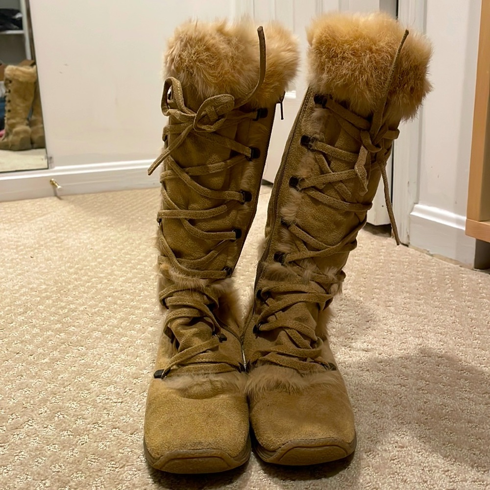 Suede and fur lace up tall boots.